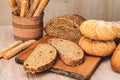 ÃÂ¡risp bread with buns. French baguettes. Fresh crispbread. Bread background. Different breed on wooden background